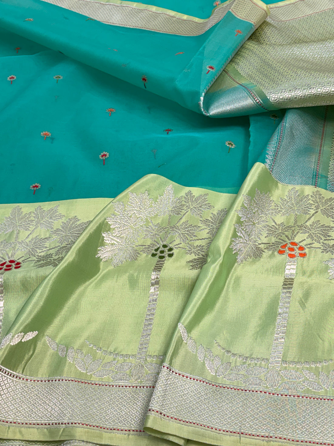 Teal Blue Kora Organza Kadhiyal Banarasi Saree with Artistic Meenakari Border
