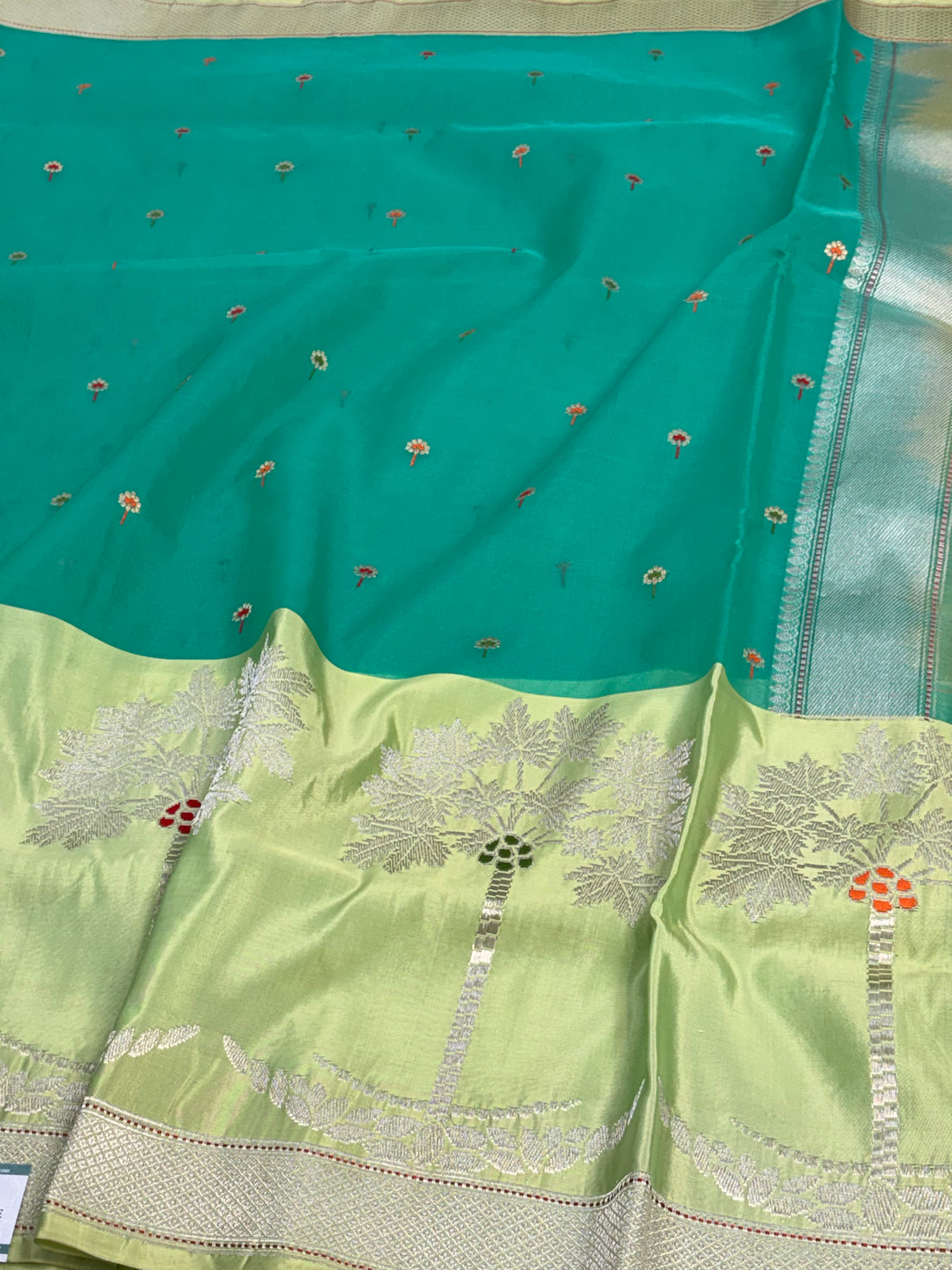 Teal Blue Kora Organza Kadhiyal Banarasi Saree with Artistic Meenakari Border