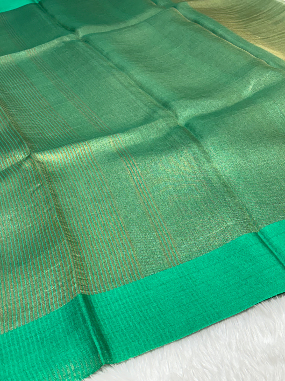 Molten Emerald Green Pure Tissue Banarasi Saree with Satin Katan Silk Border