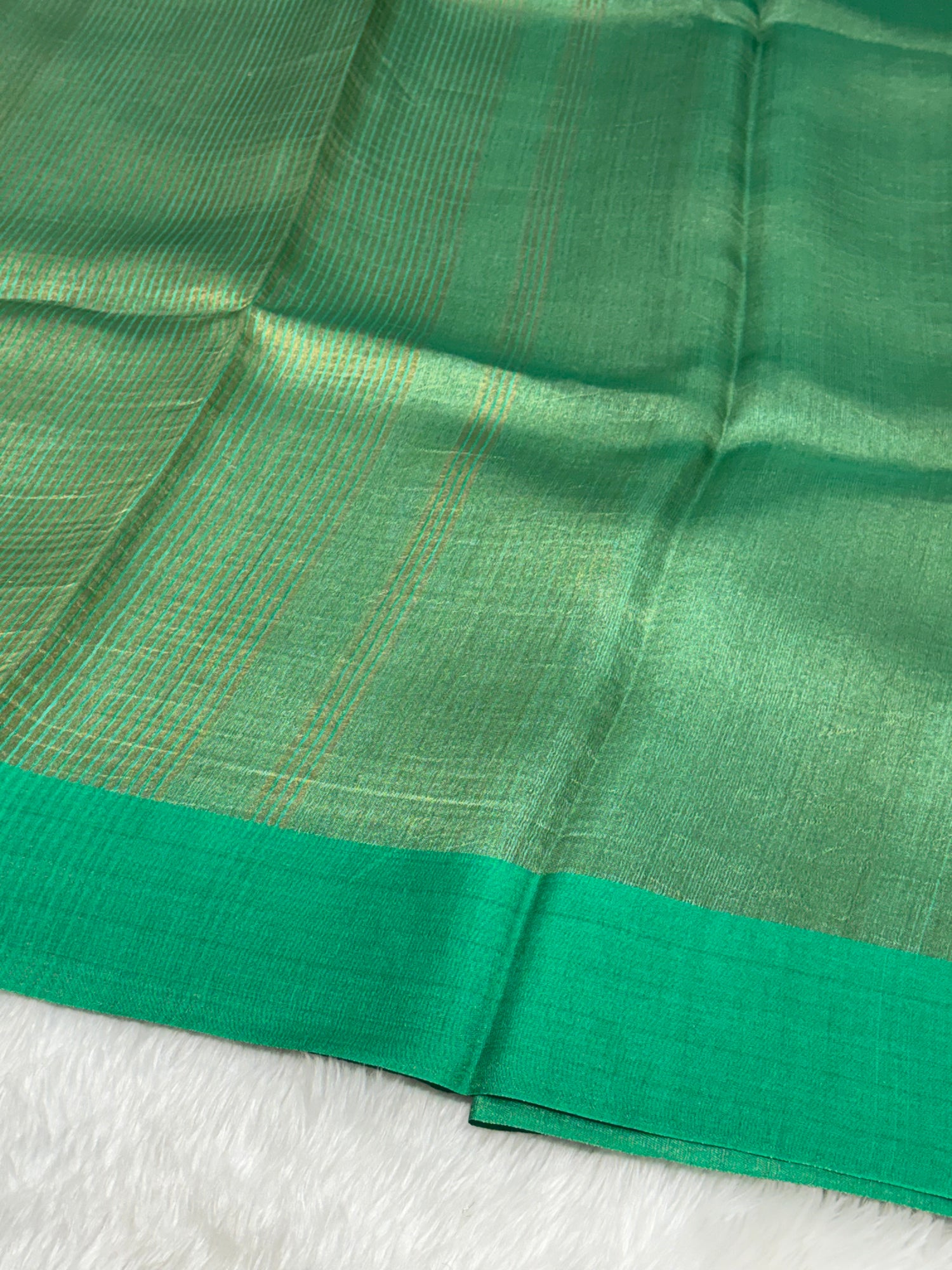 Molten Emerald Green Pure Tissue Banarasi Saree with Satin Katan Silk Border