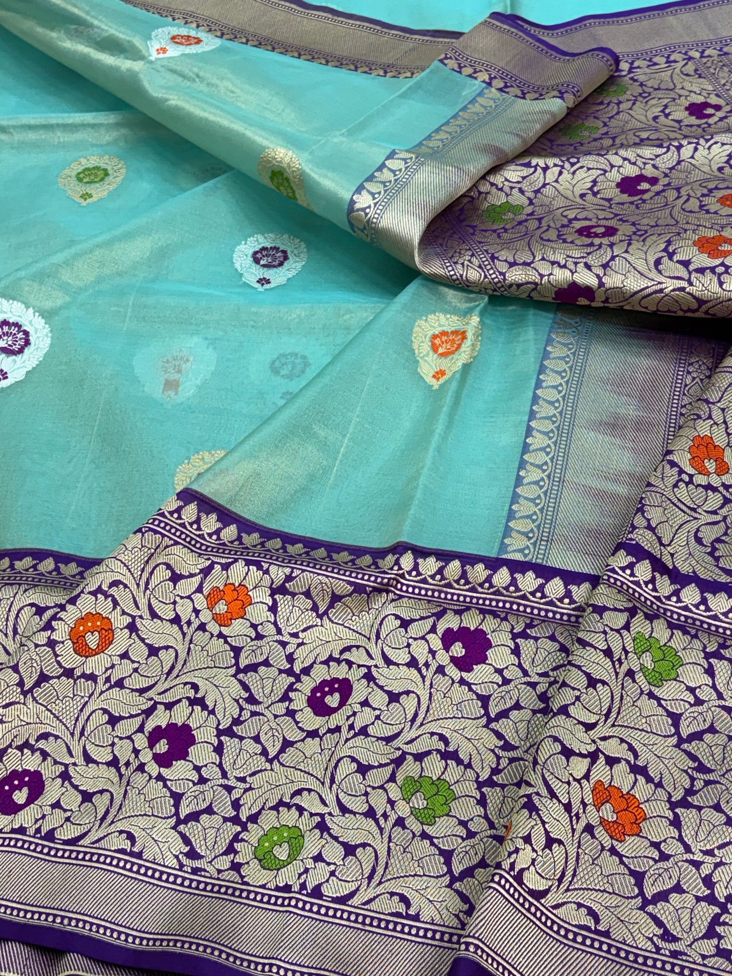 Teal Blue Handwoven Banarasi Tissue Silk Saree with Purple Meenakari Kadhiyal Katan Silk Border